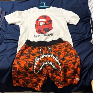 Bape White Tee with Red Graphic and red Camo Shark Shorts